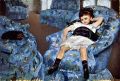 Small girl in the blue armchair