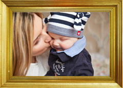 A beautiful picture of mother and child bordered by a high quality wood frame