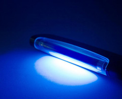 A UV light is used to cure the inks as they pass through the flatbed printer