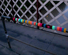 A yarnbombed railing in Bristol, England