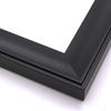 This solid wood frame features a shallow scoop profile subtle ridged edge.  The face is a solid matte black that gently draws the eye toward the artwork.

2 " width: ideal for medium or large images.  This simple frame is the perfect border for a greyscale photograph, or brightly coloured oil painting or print.