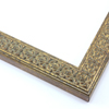 This slim, ornamented design features bevelled inner and outer edges and a celtic cross pattern in relief  The solid wood frame is covered in a gold foil with a faint brown patina that gives it an antiqued look.

1.25 " width: ideal for smaller artwork.  Photographs, paintings and giclee prints will shine within this detailed frame.