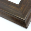 This large, scoop profile frame features a steep ridge that slopes gently toward the artwork, and steeply away.  The bronzed walnut wash highlights the natural wood grain with glossy golds and matte browns.

3.5 " width: ideal for oversize images. The elegant simplicity of this frame makes it suitable for a wide variety of photographs, paintings and giclee prints.