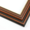 This stepped, reverse scoop frame with raised outer edge features a walnut wash that highlights the natural wood grain. The recesses of the profile are matte black, with a cracked gold foil on the inner lip.
1.75 " width: ideal for medium size images. A wide variety of photographs, paintings and prints will be enhanced within this unique frame.