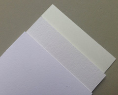 three fine art papers closely compared show difference in whiteness