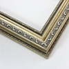 This highly detailed, solid wood frame features three distinct designs. The dominant design tops a deep scoop of smooth, brushed silver foil and meets a small detail on the inner lip. A drop ledge on the outer edge is decorated in a simple dash. Matte areas within the designs create an antiqued look.
2 " width: ideal for medium- to large-size images. The detailed nature of this frame makes it suitable for bright or busy paintings or photographs. It may overpower simpler images.