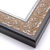 An ornate, solid wood frame featuring an intricate design overlaid with elegant silver leaf, and lightly antiqued. A shallow scooped profile and unadorned inner edge draw the eye inward. A dark brown outer edge highlights the design.
2.75 " width: ideal for large and oversize artworks. Oil paintings, Giclée prints and formal family photos will be equally at home encased in this traditional frame.