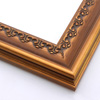 This solid wood frame features a crown moulding profile in a dark, brushed gold. The slight distressing on the deeply scooped face and around the delicate inner design give it an antique look that suits old paintings and family portraits alike.
2.25 " width and 1 " high at outer edge: ideal for medium- to large-size images.