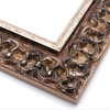 This ornate, intricate frame features a bold relief design in gold and black-mottled, antique silver foil, to match the raised, roughly textured silver foil inner lip.
2.75 " width: ideal for large images. Select a strong piece of artwork to avoid having it overpowered by this decadent frame.