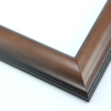 This simple, reverse curve frame features a walnut-wash, natural wood grain. The subtly bevelled inner and outer edges are matte black.
1.75 " width: ideal for small or medium size images. The plain, natural appearance of this frame makes it a great border for almost any artwork: photograph, painting or giclee print.