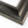 This bold frame features a steep reverse scoop profile with a broken line detail on matte black. The inner lip drops sharply in toward the image; both edges are brushed with a subtle silver leaf.
3 " width: ideal for large or oversize artwork. Select a strong image for this frame, to ensure the heavy border doesn